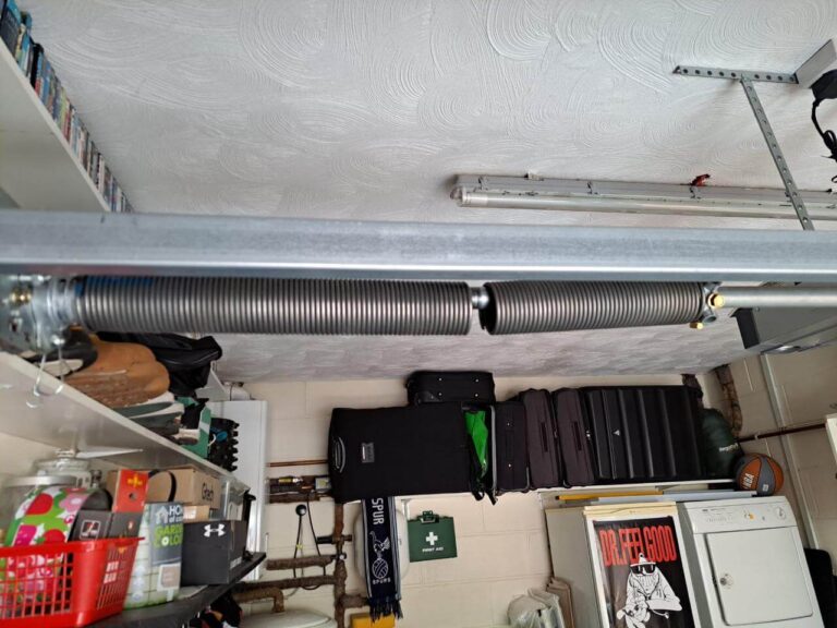 snapped garage door spring repair in Essex